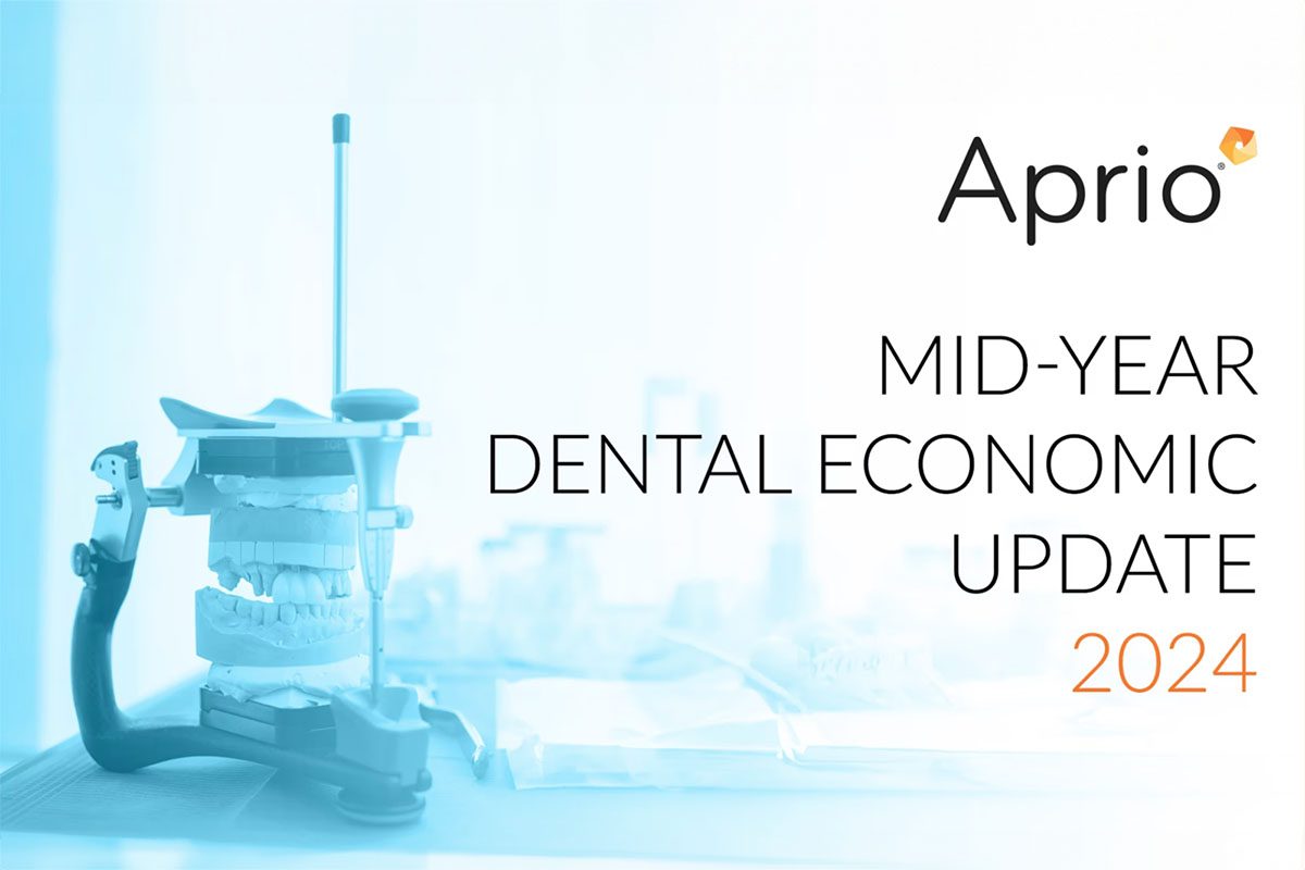 Dental model and tools on a table with text: Aprio MID-YEAR DENTAL ECONOMIC UPDATE 2024 on a light background.