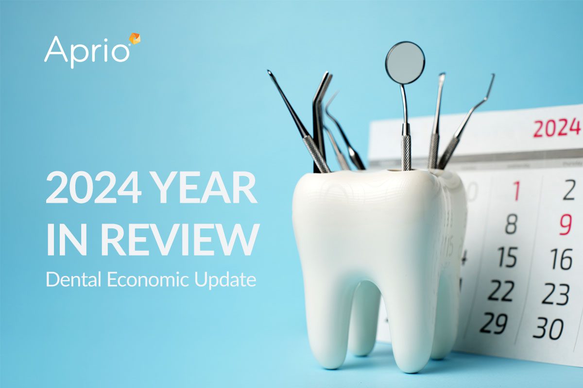A tooth-shaped holder with dental tools in front of a 2024 calendar