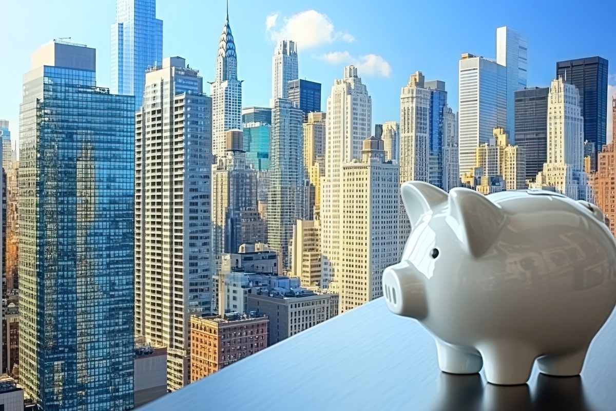 Piggy bank in front of a cityscape, symbolizing saving and investing